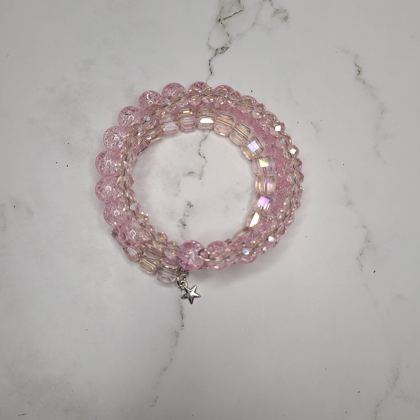 Handmade Pink Glass Beaded Memory Wire Bracelet with Small Silver Star charm.